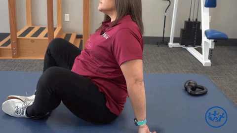 Physical therapist demonstrates a frog/groin stretch, a great pregnancy exercise for pelvic health.